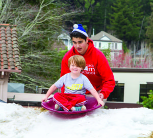 Kids get to go snow sledding at the Mill Valley Winterfest on December 4 at the Downtown Plaza in Mill Valley. Photo by Kirke Wrench.