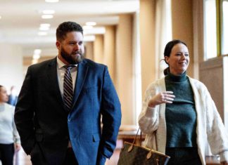 San Rafael cop found not guilty of felony charges is with his criminal defense attorney.